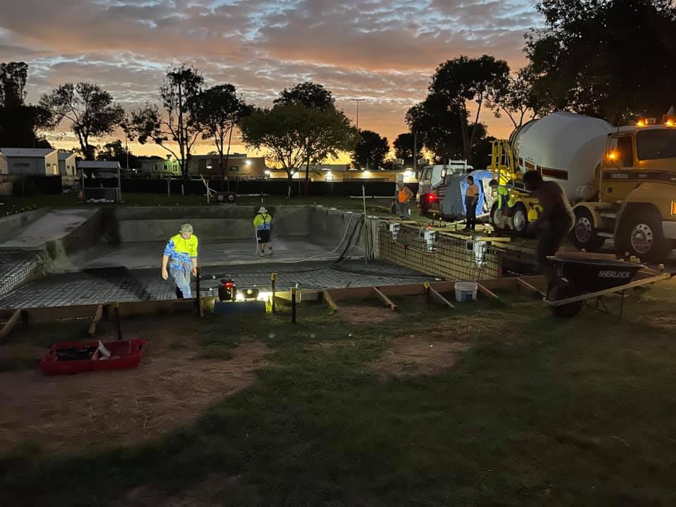 Commercial swimming pool builders at night